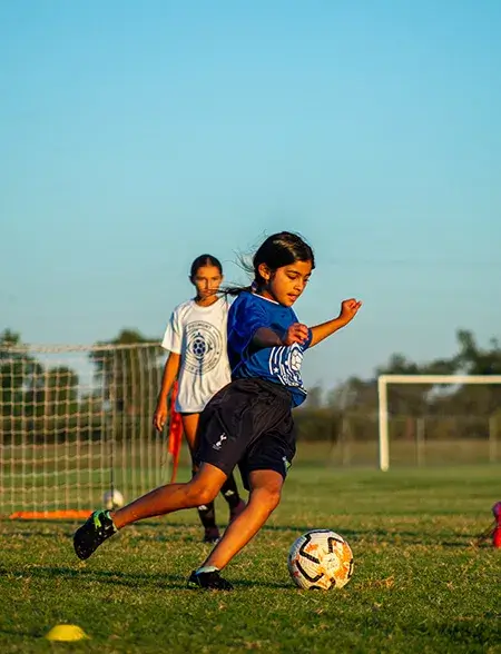 Girl playing soccer